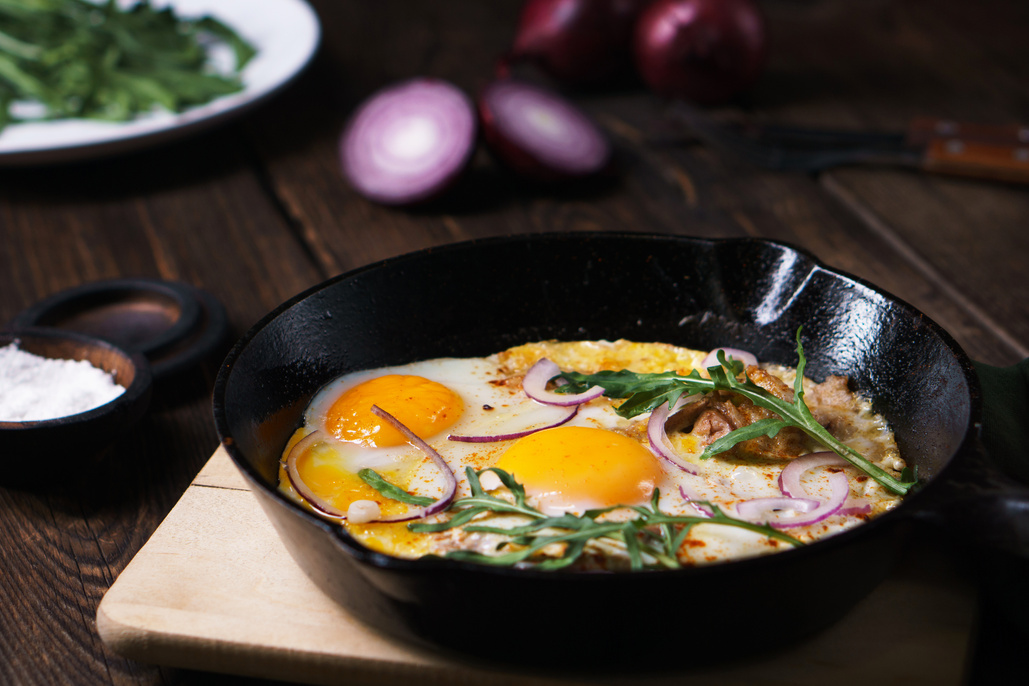 homemade cheap food, eggs and bacon in pan