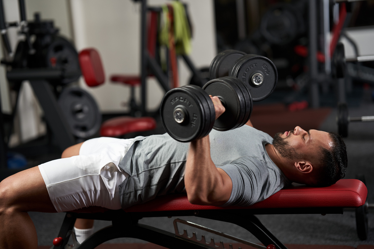 Bodybuilder Doing Bench Press with Dumbbells